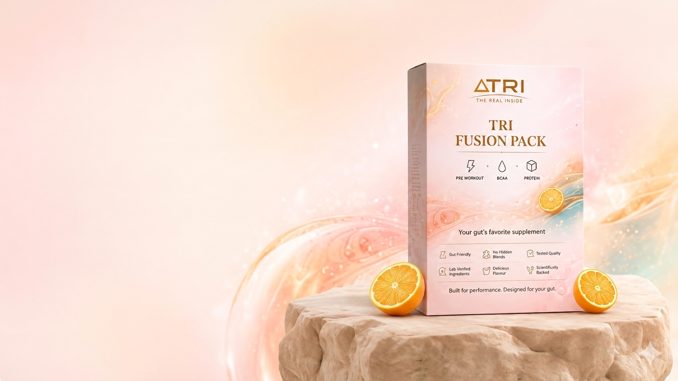 THE REAL INSIDE TRI Fusion Pack on stone pedestal with oranges